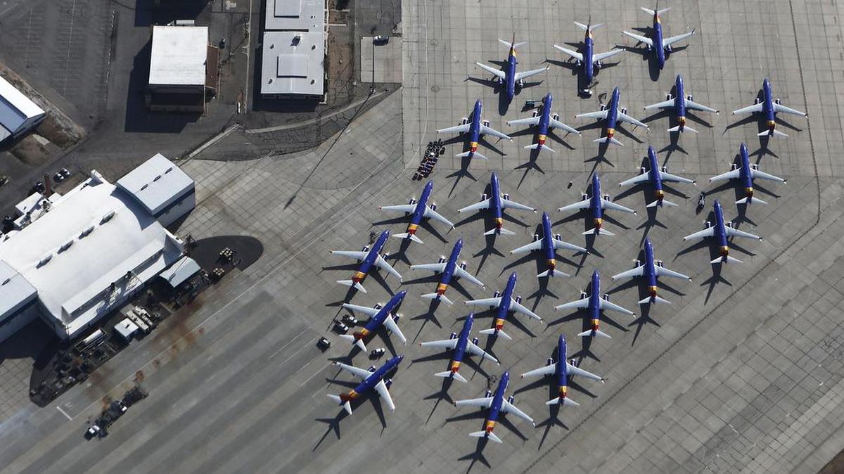 A number of Southwest Airlines Boeing 737 Max aircraft are parked at Southern California Logistics Airport on March 27. The company is due to report first-quarter financial results on Wednesday. Five days later, it holds its annual shareholder meeting. What would have been celebrations of Boeing’s unrivaled success of its latest 737 model instead find the company defending its procedures and products while working to fix software under scrutiny in two deadly crashes.
