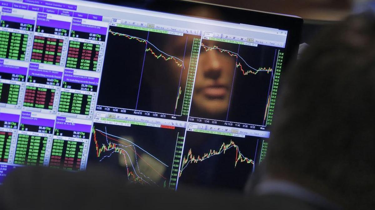 Specialist Frank Masiello is reflected in his screen on the floor of the New York Stock Exchange in 2015. Investors are closely watching bond interest rates as a signal of market worries.
