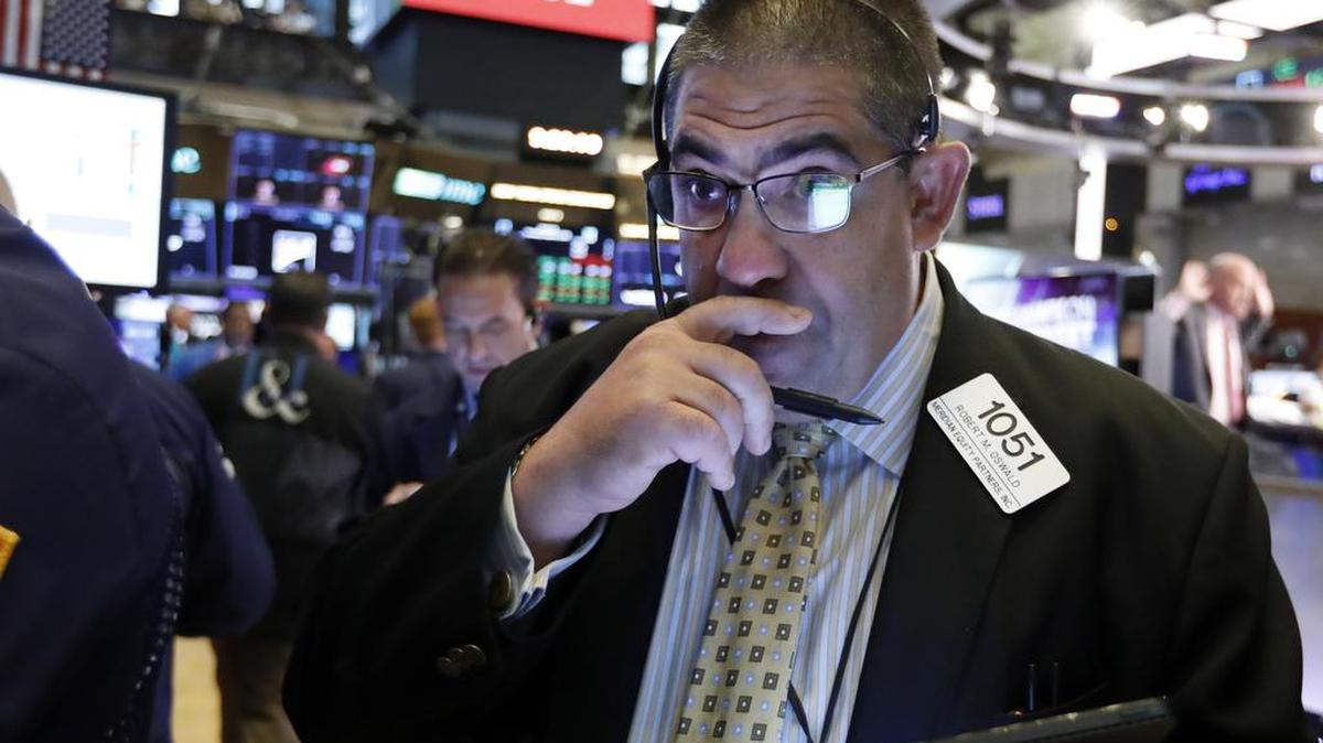 Trader Robert Oswald works on the floor of the New York Stock Exchange on Thursday.Stock prices rose Thursday as investors braced for the next development in the U.S.-Chinese trade war, which has caused volatility in world markets.
