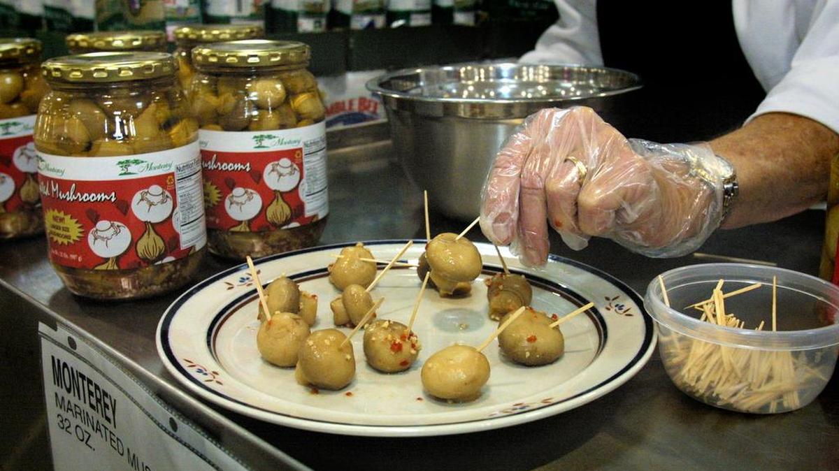 A demonstrator offers free samples of marinated mushrooms to shoppers at Sam’s Club in Coral Springs. The concept of offering freebies to potential customers is simple, says revenue-strategy expert Adam Snitzer: Remove the risk from a purchase decision. Let people have a taste of your product for free and then, if they like it and want more, ask them to pay for it.