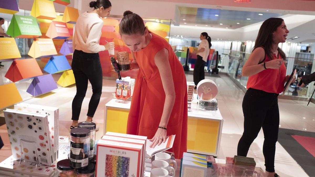Shoppers brows at the opening day of “Story” at Macy's in New York. The Conference Board’s monthly Consumer Confidence survey will be released Tuesday.