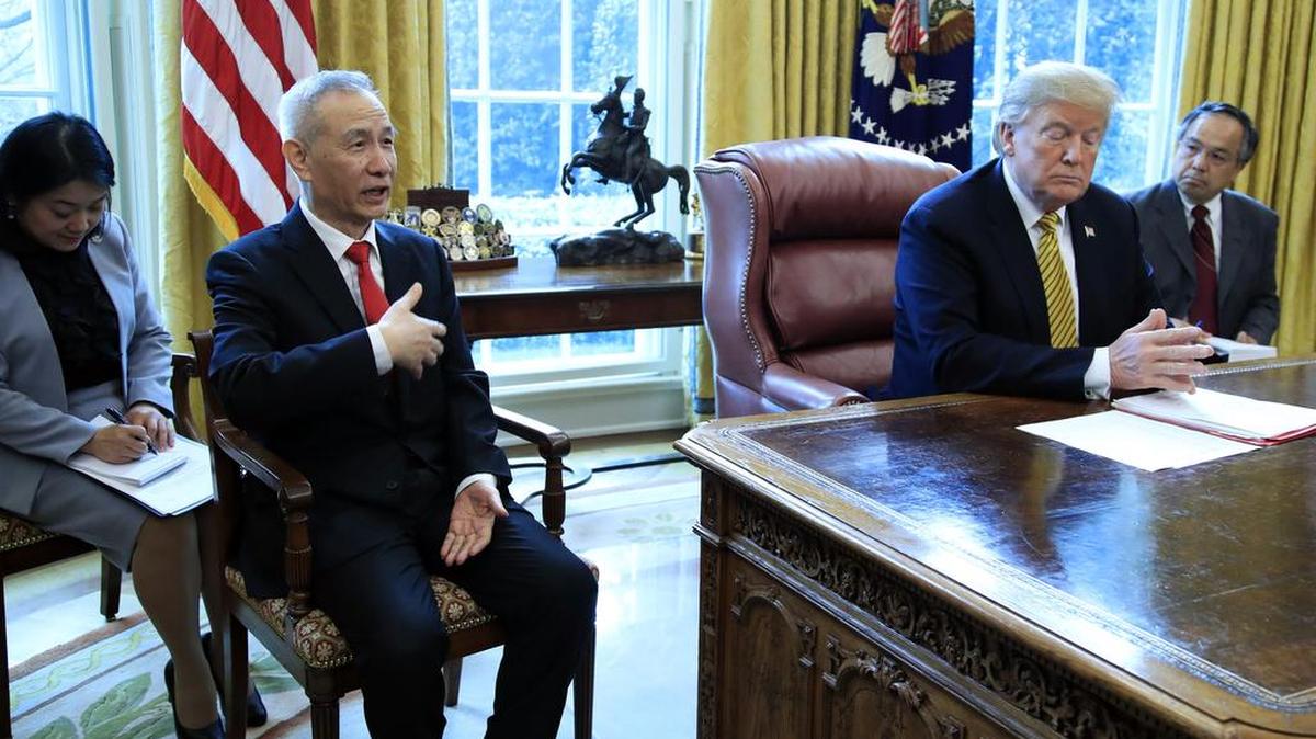 President Donald Trump listens to China's Vice Premier Liu He speak during their meeting in the Oval Office of the White House in April. Lieu, the No. 2 person in the Chinese government, is expected in Washington during the week. His trip signals talks are maturing toward some kind of outcome after months of on-again, off-again discussions and after both countries have traded escalating tariffs.