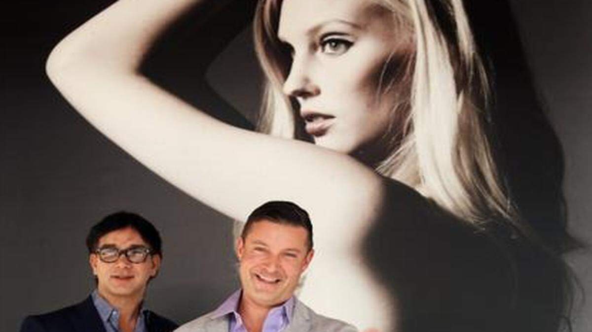 
Couturier: René Ruiz, left, and business partner Brad Rosenblatt hold parties with a charitable bent to draw clients to the Coral Gables store, relocating to Merrick Park.



