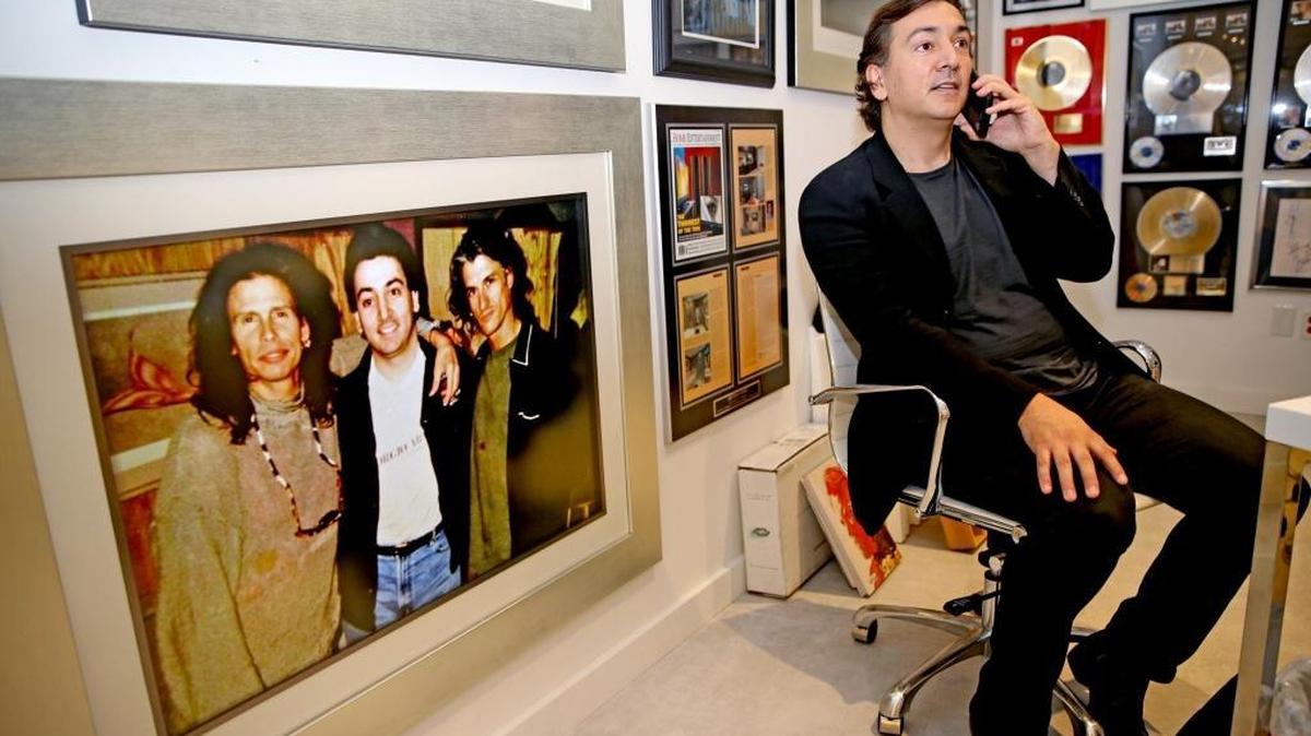 Audio One founder David Frangioni hangs out in his Sunny Isles office, surrounded by photos of rock stars. His company designs and installs high-end home and office automation systems, home theaters and recording studios.