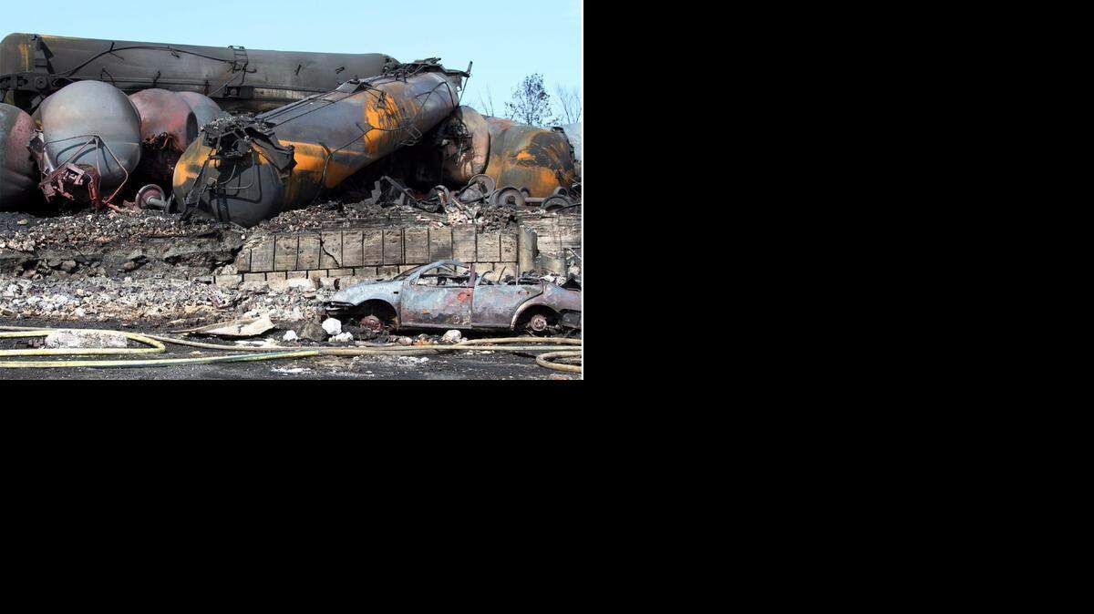 
This photo provided by Surete du Quebec, shows wrecked oil tankers and debris from a runaway train on Monday, July 8, 2013 in Lac-Megantic, Quebec, Canada. A runaway train derailed igniting tanker cars carrying crude oil early Saturday, July 6. At least thirteen people were confirmed dead and nearly 40 others were still missing in a catastrophe that raised questions about the safety of transporting oil by rail instead of pipeline. 
