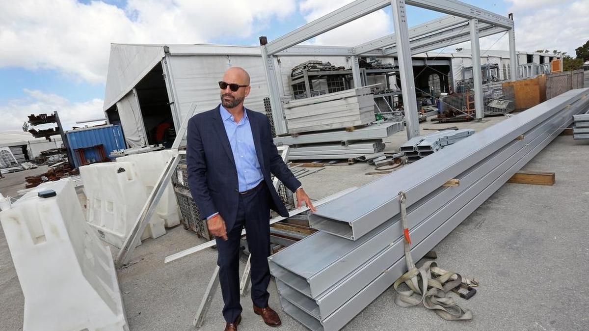 Alain Perez of Eventstar checks aluminum beams that are foundation structures for tents and modular buildings on March 30, 2018.
