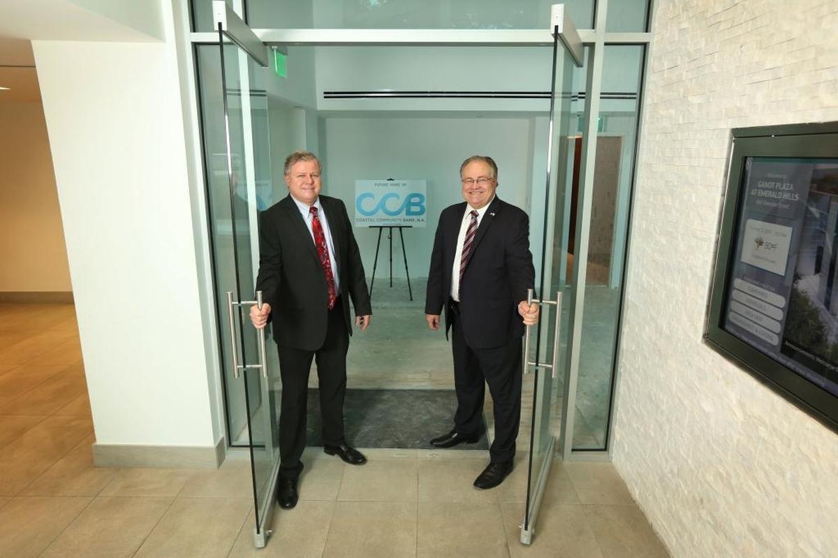 Jim Afflerback, executive vice president and COO, left, poses with Joe Dorsey, CEO and president of the proposed new Coastal Community Bank bank.