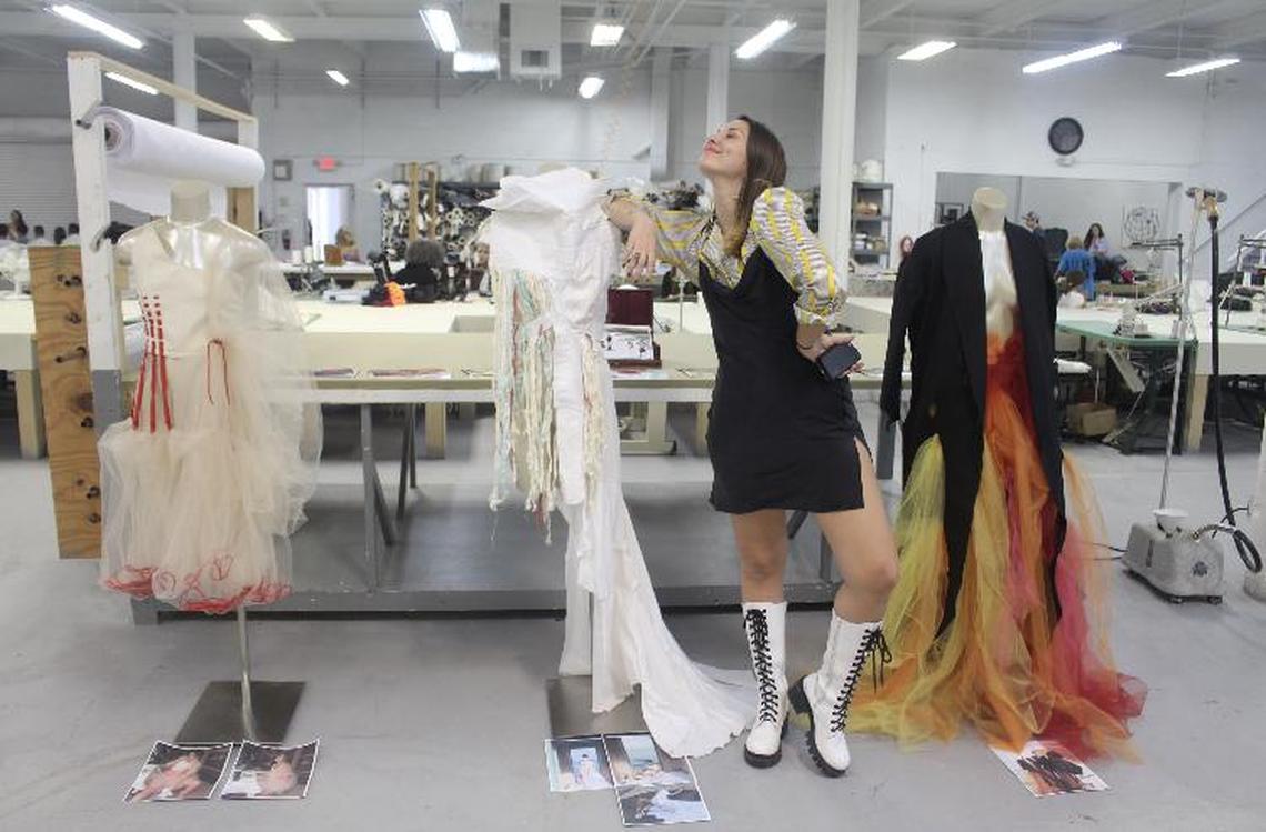 Ana Dalessio, former student at Miami Dade College’s Miami Fashion Institute, with three of her creations at Miami Fashion Institute at Miami Dade College.