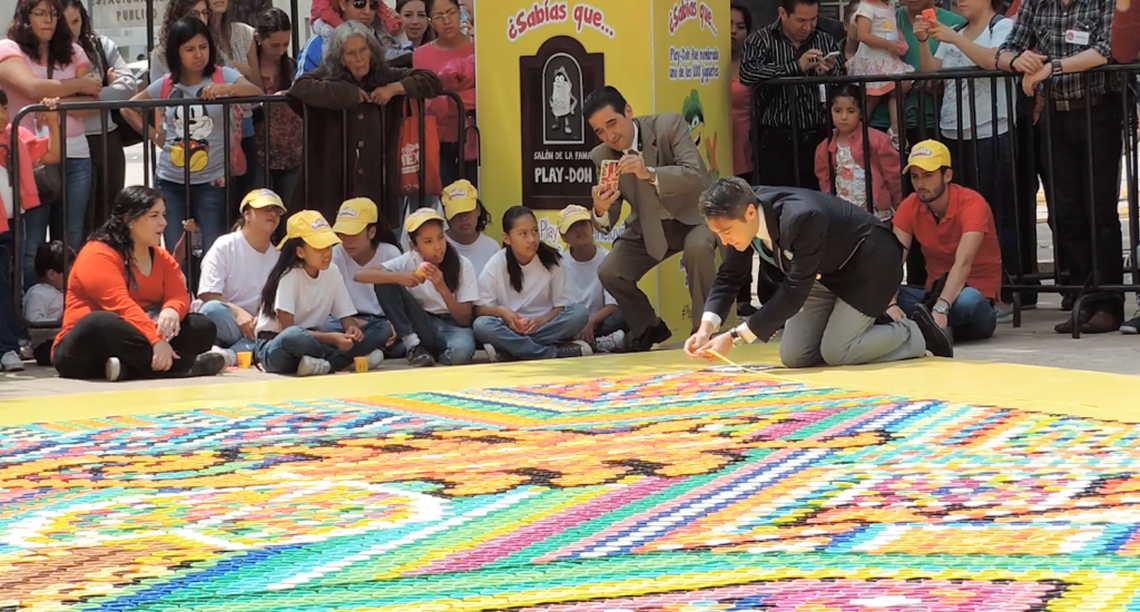 Carlos Martinez measures the world’s largest plastic tub mosaic in Mexico City, Mexico on September 23, 2016. The mosaic is 121 square meters.