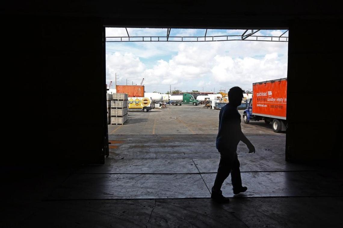 An employee walks by a cargo loading door at the large Allapattah warehouse owned by the Bos Group.