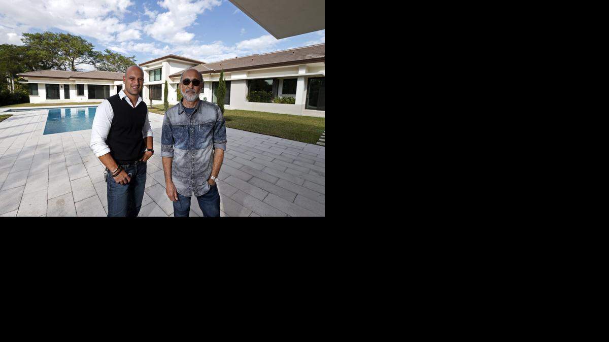 
Eurohabitat in Pinecrest is a family-run builder of high-end homes with an interesting business model: It incorporates each home as a subsidiary of the business. At right, Director, Ed Gugliotta is seen here with his son Alessandro Gugliotta at a completed home in Pinecrest on Feb.6, 2015
