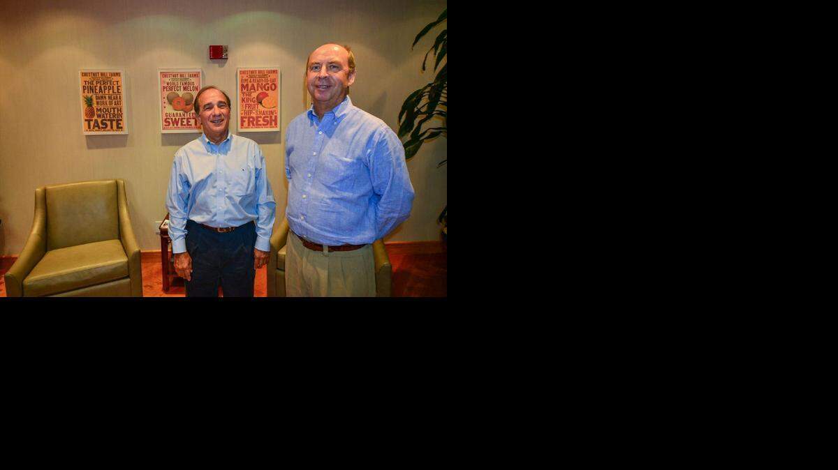 
Blooming business: Chestnut Hill Farms COO Raul Romero, left, and CEO Trond Jensen work at the company’s headquarters in Coral Gables.
