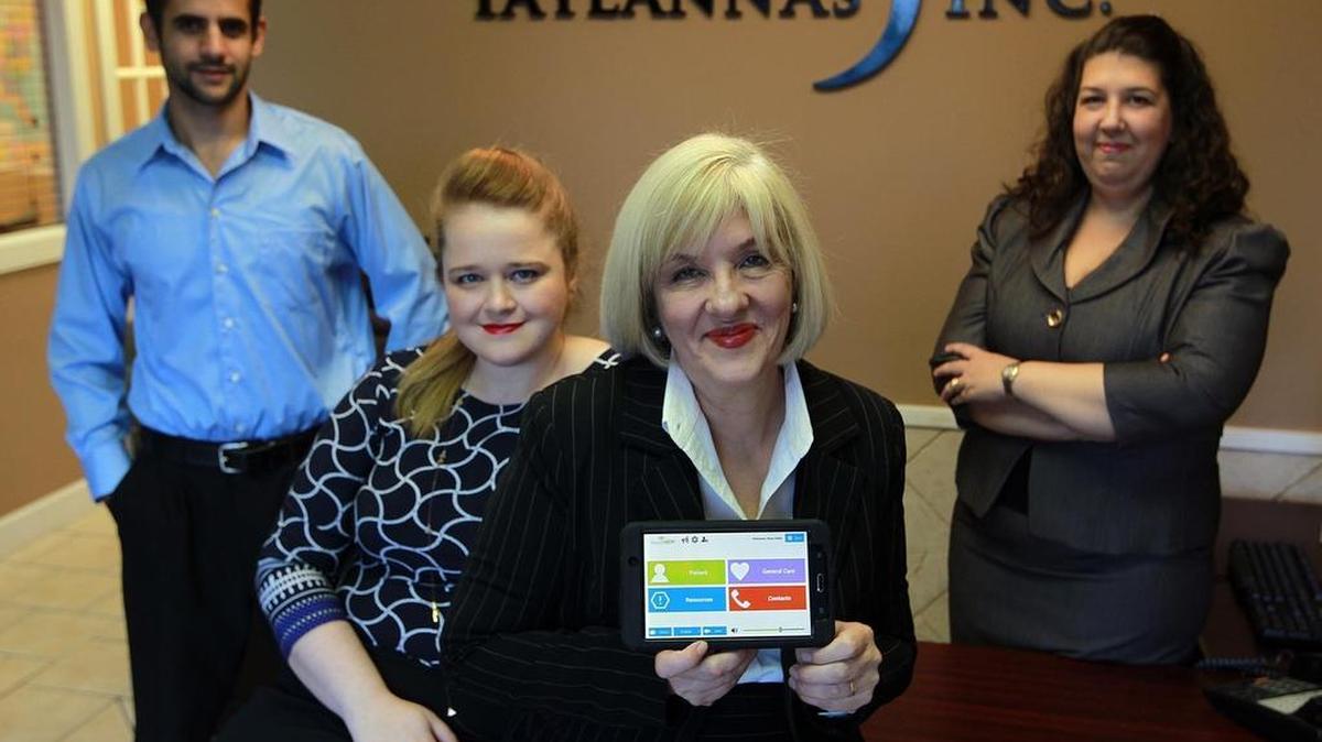 Susan Perry, center, is founder and CEO of Taylannas, a company that makes products that speak for those with language and reading obstacles. From left is Daryl Viamonte, Crystal Ice and Olivia Gomez.