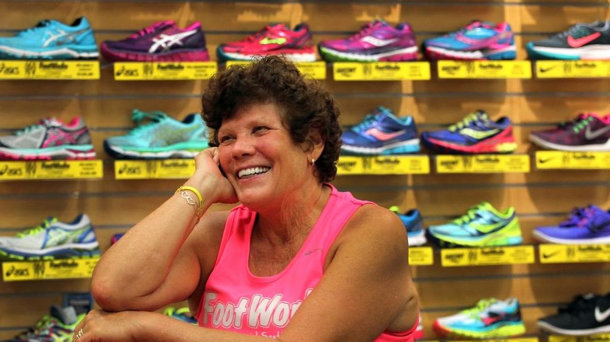 
Owner Laurie Huseby smiles with customers at FootWorks on Aug. 18, 2015. 
