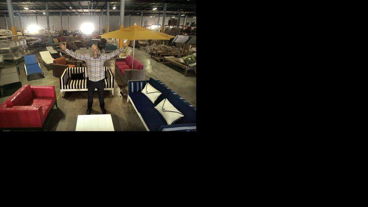 ‘GROWING BY LEAPS AND BOUNDS’:  Gerald Shvartsman, CEO of Source Outdoor, shows off furniture in the company's warehouse/showroom in Miami. It specializes in outdoor furniture, awnings and railings for the hotel, restaurant and residential markets.