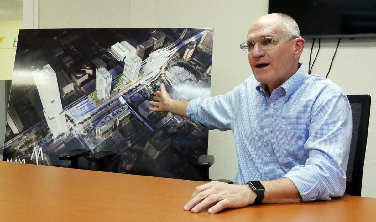 Michael Reininger on Oct. 18, 2016 in Miami. At the time, he was president of All Aboard Florida. He is shown with a rendering of the finished project.