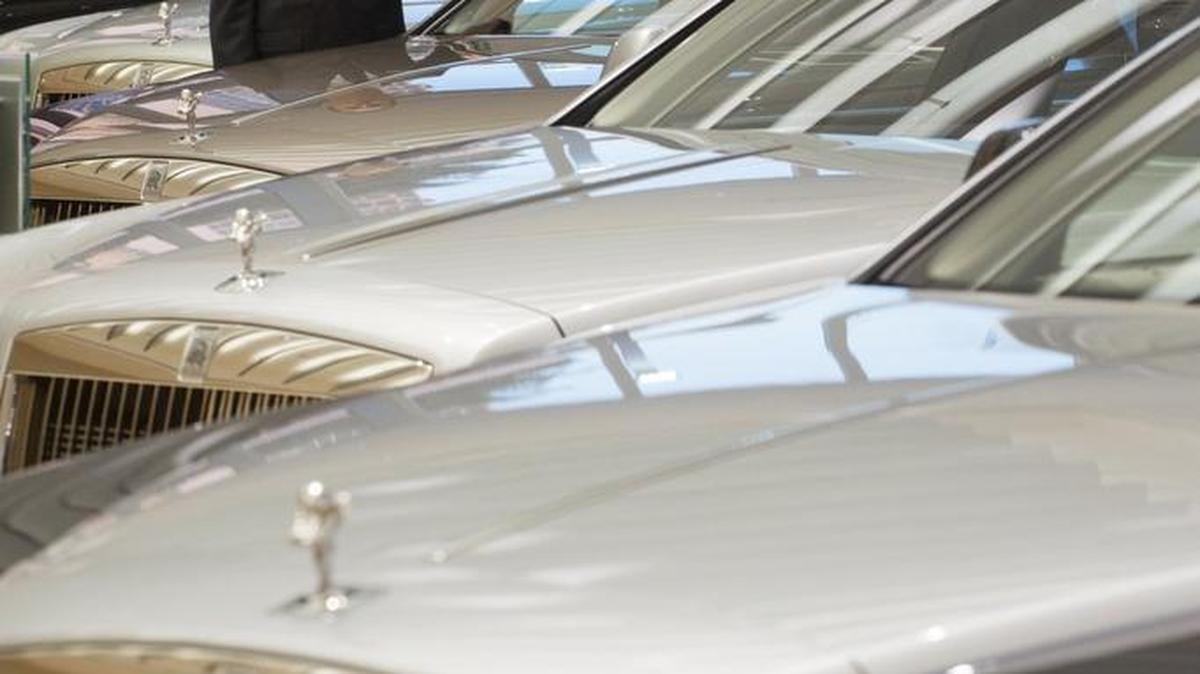 Joe Wierda, general manager for Rolls-Royce Motor Cars Southern Region, with several models of the luxury car in the showroom at the dealership in Edgewater Nov. 5, 2015.