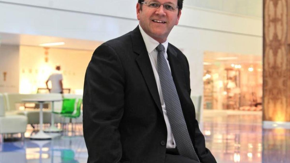 
John Garvalia, leasing director with Cohen Brothers at DCOTA, is shown at the center.
