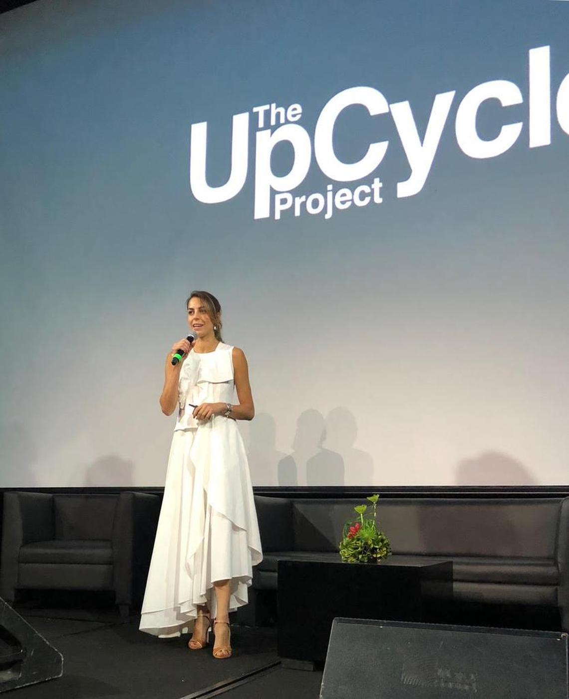 Gabriella Smith, who leads The UpCycle Project, wears a dress that Istituto Marangoni student Rene Mejia created from discarded bedsheets as part of The Upcycle Project. She is speaking at a Costa Rica fashion week event.