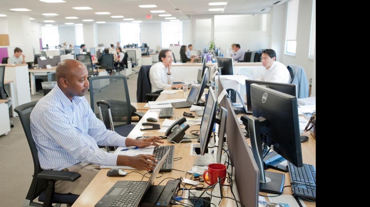 
Workers in one of the operations rooms at the Cable and Wireless Communications group operating hub for the Caribbean and Latin America on June 16, 2015, in Coral Gables.
