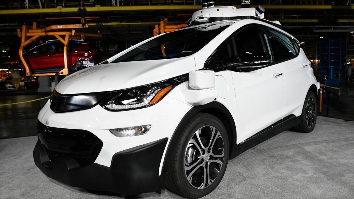 In this Tuesday, June 13, 2017, file photo, a self-driving Chevrolet Bolt EV that is in General Motors Co.'s autonomous vehicle development program appears on display at GM's Orion Assembly in Lake Orion, Mich.