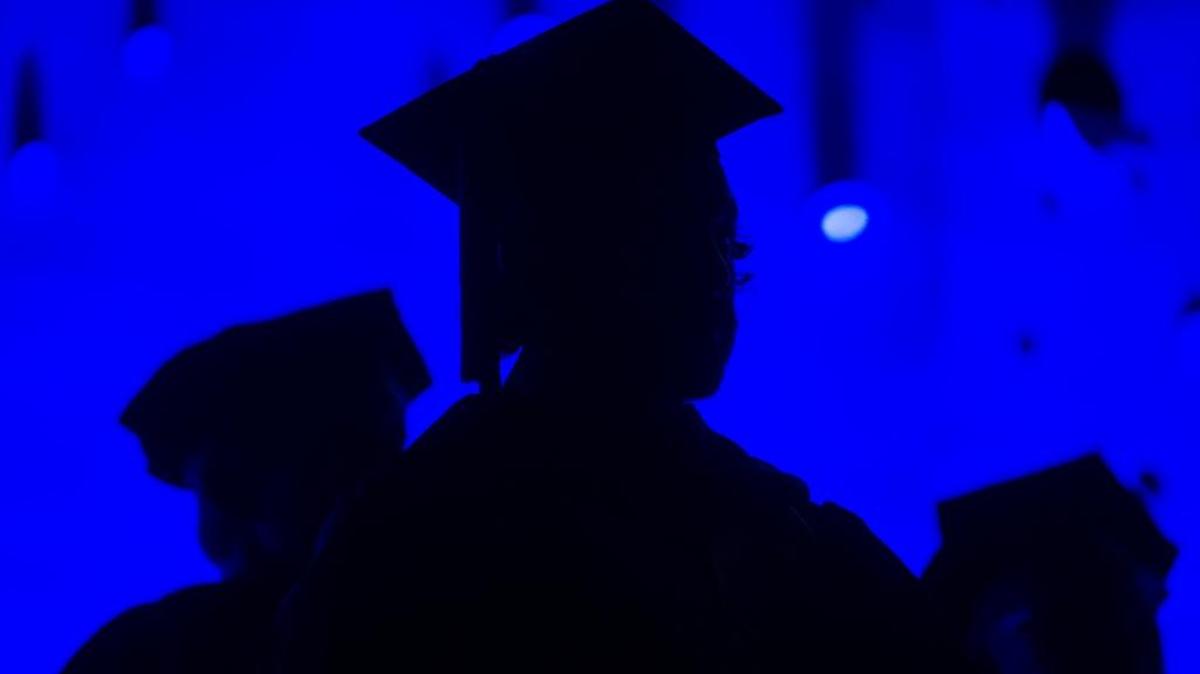 In this May 31, 2014, file photo, members of the graduating class and faculty attend the Savannah College of Art and Design commencement in Atlanta. For the first time on record, living with parents is now the most common arrangement for Americans ages 18 to 34, an analysis of Census data by the Pew Research Center has found.