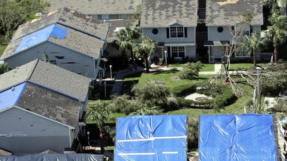 Homeowners covered their roofs in blue tarps to cover damage cause by Hurricane Wilma in Broward County in 2005. Widespread damage can cause insurers to go under or pull out of the state.