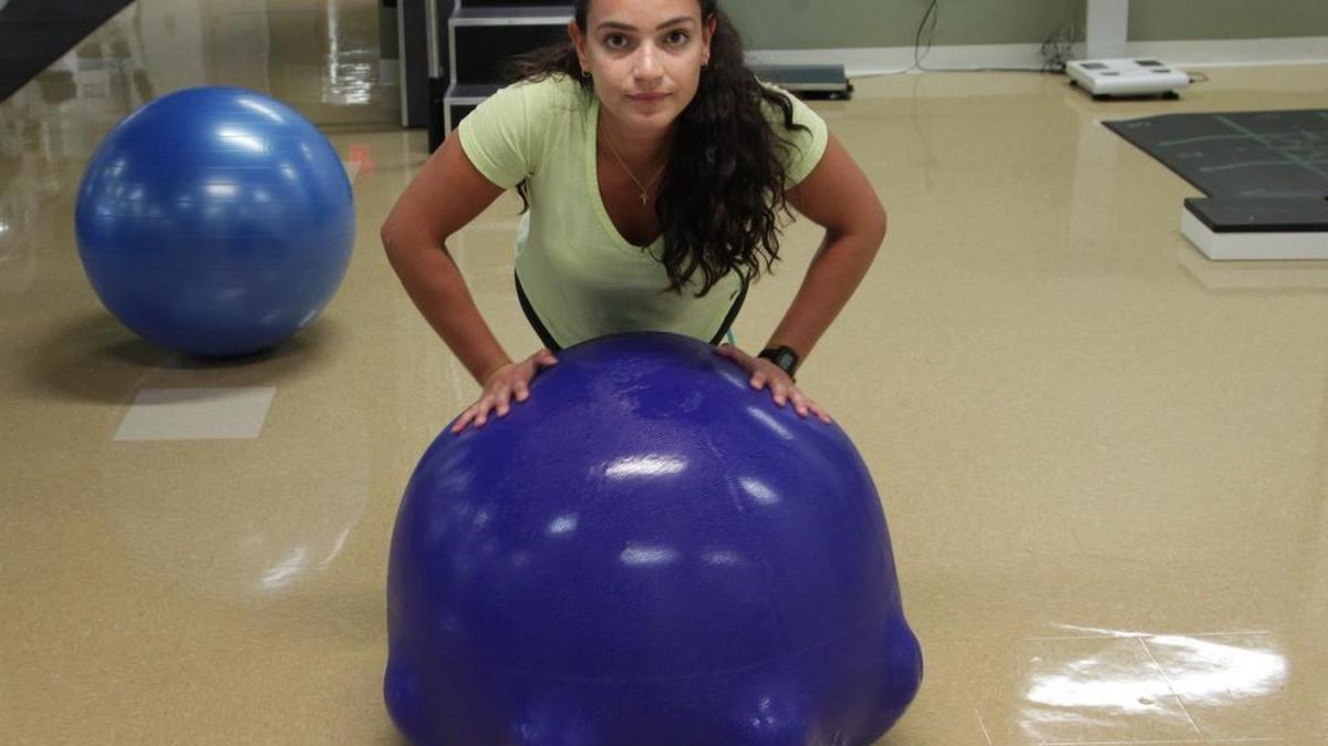
Fitness equipment: Maria Carolina Massoni Martins, a UM senior, works out on the Best Ball during a demonstration of the product. Samuel Hollander and Joseph Signorile created the Best Ball, which they say is a big improvement on the 50-year-old stability ball you see in gyms all the time, and they hope to go to market with the product early next year.

