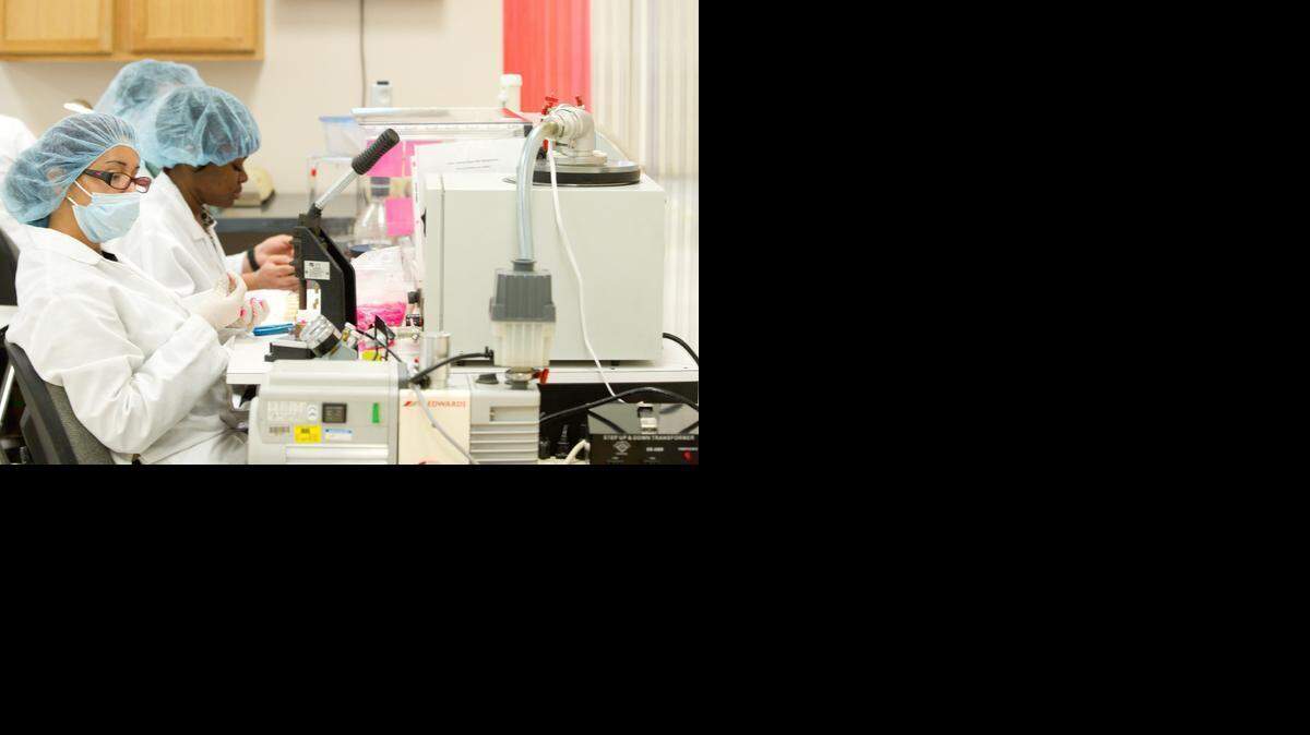 
Workers at the Erba Diagnostics plant in Miami Lakes on Monday, Feb. 23, 2015. The plant employs more than 80 people in a variety of technical, scientific, and engineering roles to produce diagnostic machines, test kits and chemical reagents.
