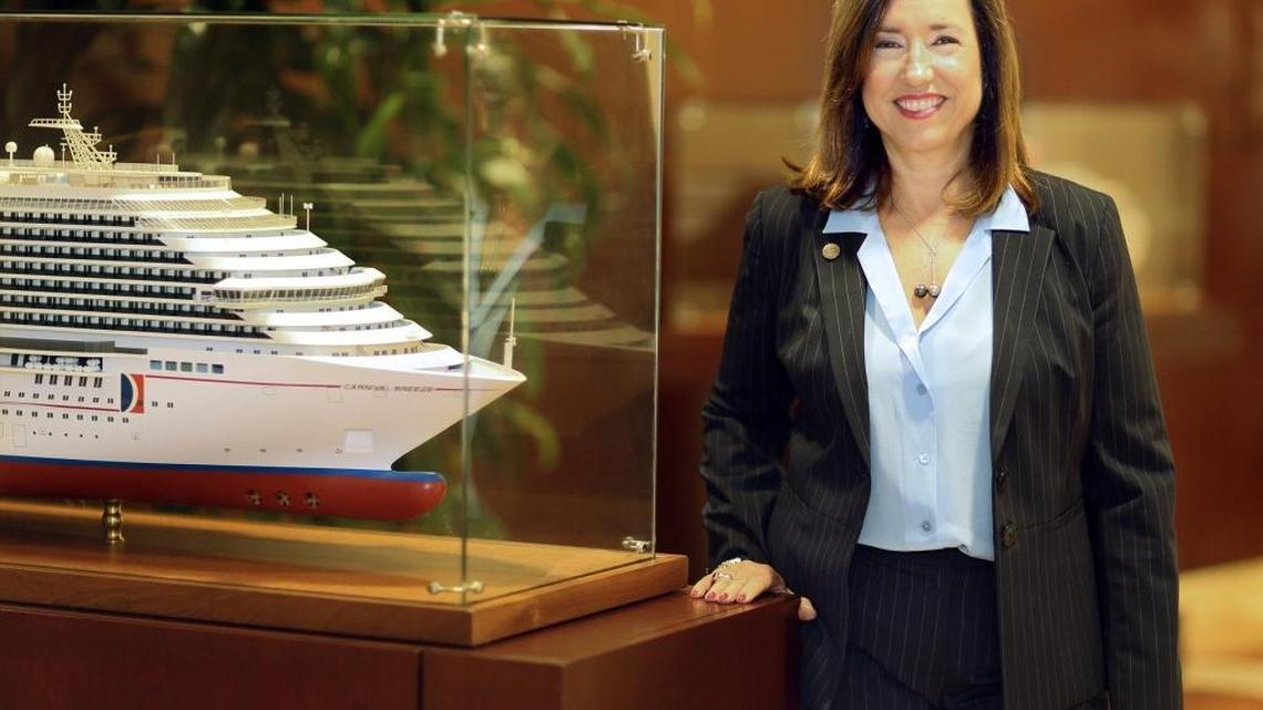 Carnival Cruise Line President Christine Duffy stands next to a model of the cruise line’s newest ship, the Carnival Breeze, at Carnival headquarters in March. Duffy has been president for slightly more than one year.