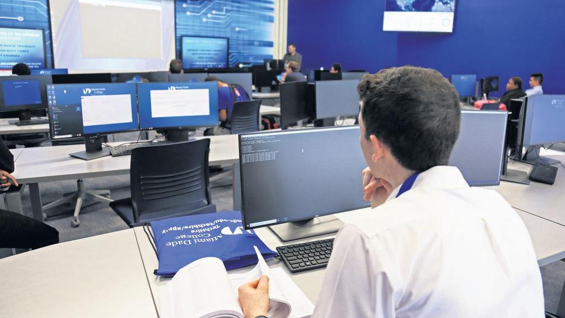 Students at the Cybersecurity Center of the Americas at Miami Dade College - Wolfson Campus in downtown Miami attend a class on July 15.