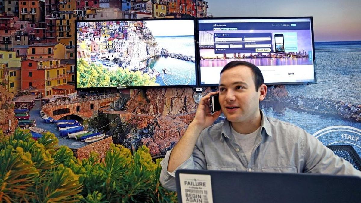 Max Lorber takes a phone call in one of the meeting rooms in the Skyscanner office in Brickell. Skyscanner, a cheap-flights website and application, opened its Miami office in the summer of 2013. The Edinburgh-based company now has 50 million unique monthly users nationwide.