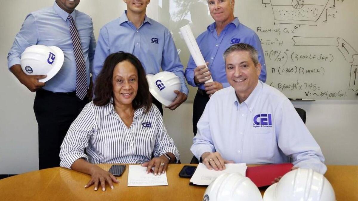 Cherokee Enterprises Inc. in Miami Lakes, is an engineering and construction firm that works on projects in environmental engineering and remediation, heavy construction and construction management, and fuel storage/delivery systems for tank farms. From left, seated: Christine Franklin, president; Gabino Cuevas, CEO. Standing, from left: Amanuel Worku, vice president of engineering services; Alex Sanchez, executive vice president; Jeffrey Northrup, vice president of sciences.