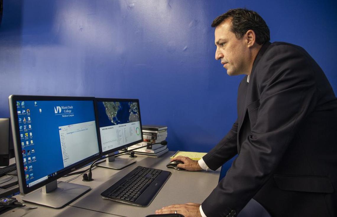 Jorge Ortega, director at the Cybersecurity Center of the Americas at Miami Dade College - Wolfson Campus in downtown Miami works on a computer on July 15.