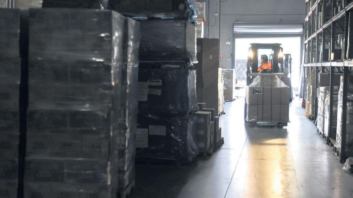 A Customs Brokerage worker moves pallets at the company’s Doral warehouse on Thursday, April 9, 2020.