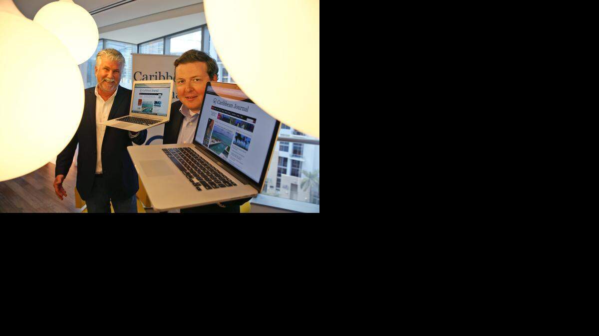 
Guy Britton, executive vice president, and Alexander Britell, editor-in-chief/founder, of Caribbean Journal in the offices of Pipeline Brickell on March 16, 2015. 

