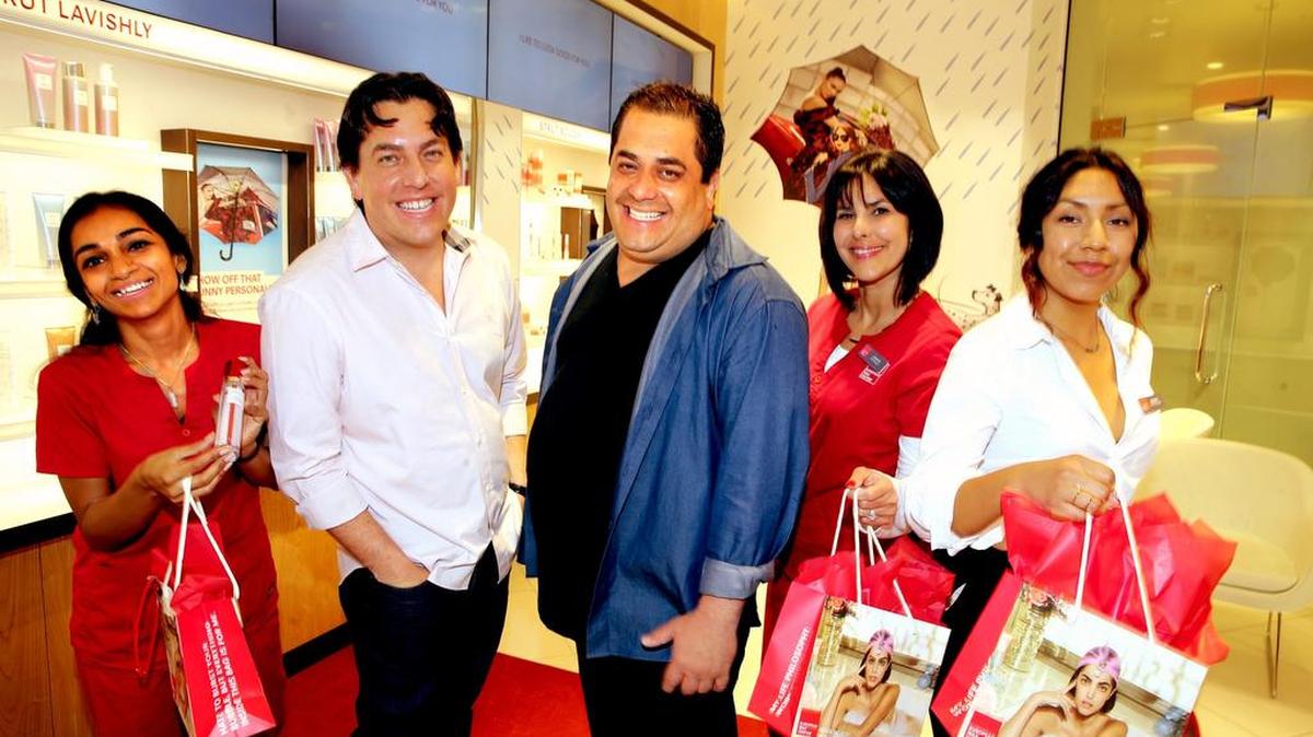 Joshua and David Coba, center, founded the European Wax Center company. They’re flanked by, from left, wax specialists Orianna Chookolingo, Lianette Torres and Amanda Lopez.