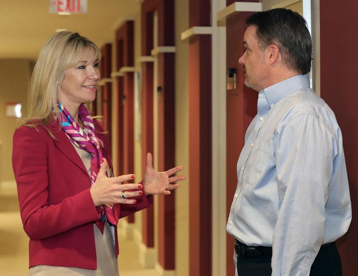 Natalia Shuman, Sunrise-based CEO for the North America region, speaks with Richard Groblewski, director of real estate and facilities for Bureau Veritas.