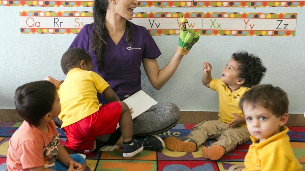 Yessenia Mercado tells a story, with finger puppets, to her students at Bee Creative Academy, a preschool in West Park on Jan. 21.