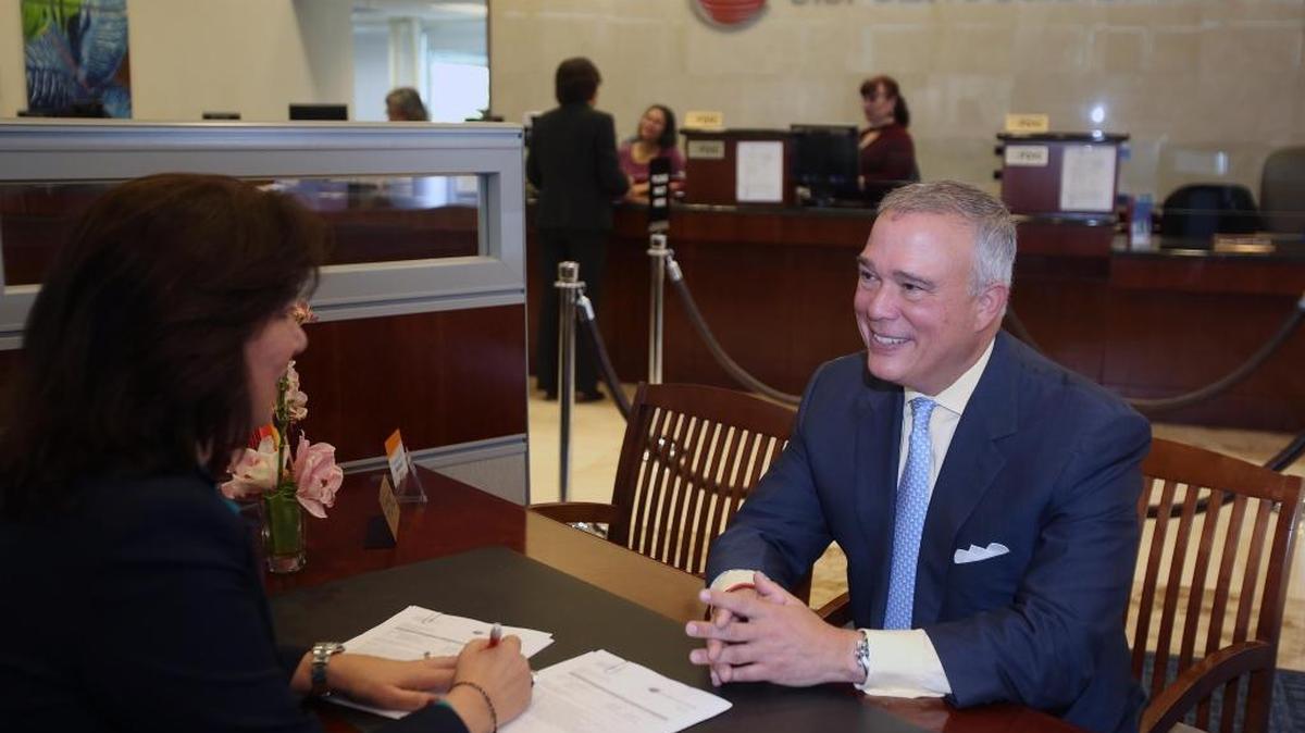 Luis de la Aguilera, right, the president and CEO of U.S. Century Bank, one of the state’s largest Hispanic-owned community banks, is shown May 11, 2018, with Raquel M. Benitez, vice president and business development officer.