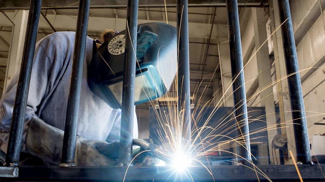 An employee welds a steel part in the metal fabrication area at the Everglades Boats manufacturing facility in Edgewaterin January 2016. Members of the Miami Herald CEO Roundtable were asked: Job growth in Miami was slow this year, compared to other areas of Florida, thanks to a recession in Latin America and Zika. What do you expect for South Florida’s economy in 2017?