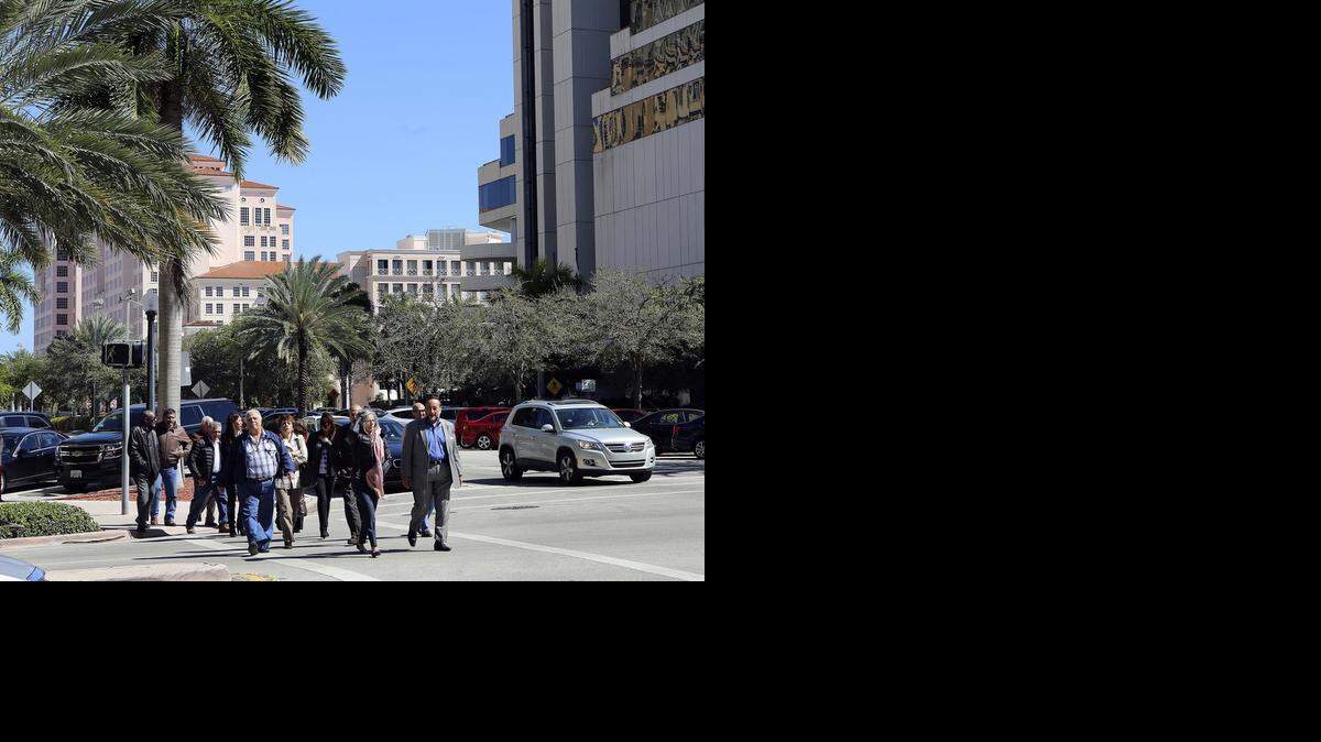
PEDESTRIAN-FRIENDLY: Coral Gables’ business district has an ambience that spans old buildings and modern architecture. This view is near the SunTrust Bank building at 201 Alhambra Circle, looking east. 
