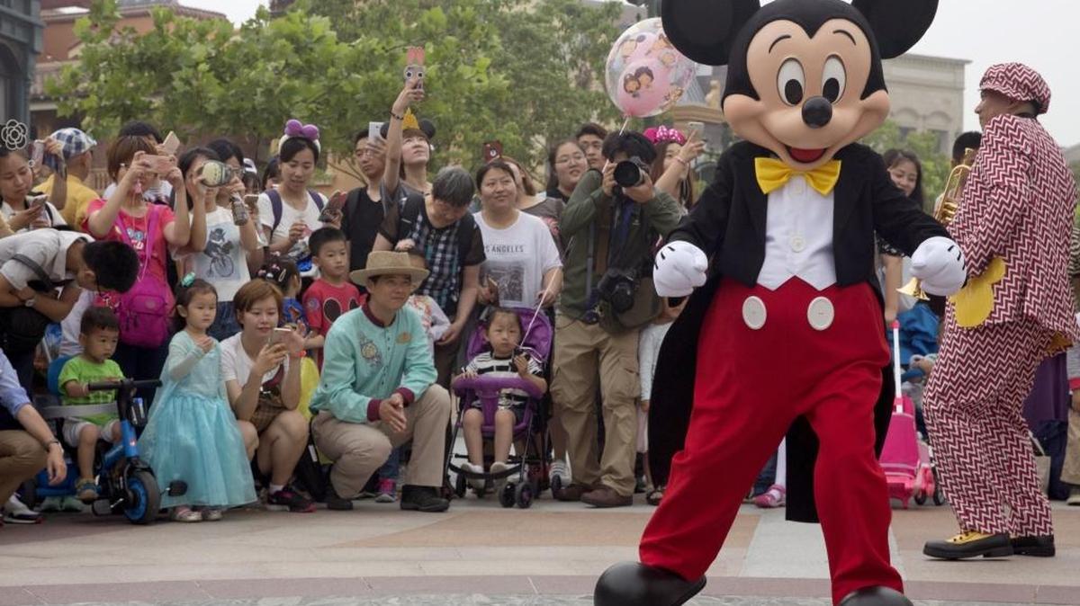Mickey Mouse entertains visitors on the opening day of the Disney Resort in Shanghai, China, on June 16, 2016. Walt Disney Co. had opened its first theme park in mainland China the day before at a ceremony that mixed speeches by Communist Party officials, a Chinese children’s choir and actors dressed as Sleeping Beauty and other Disney characters.
