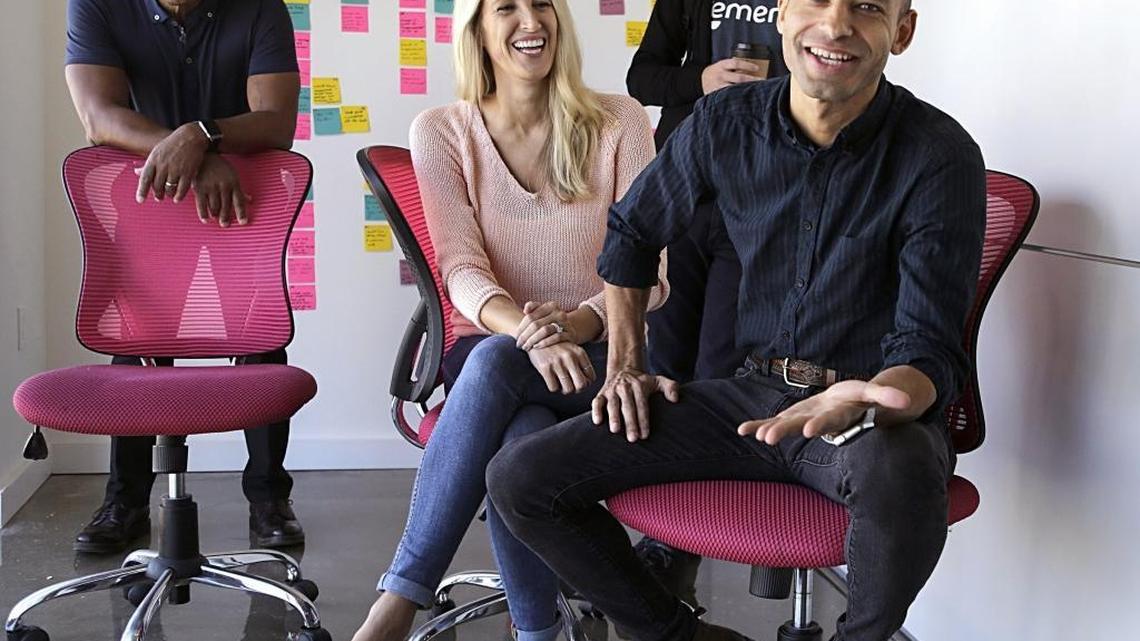 Wes Thompson, far left, founder and CEO of Emerge.me, a tech startup simplifying shopping and buying insurance for medical emergencies. He has assembled a management team, from left, consisting of Whitney Romanchuk, head of user experience; Mike Rolfe, head of product; and Marc Howard, head of growth marketing and analytics. They are seen in their Wynwood office, inside of Rokk3r Labs, on March 8.