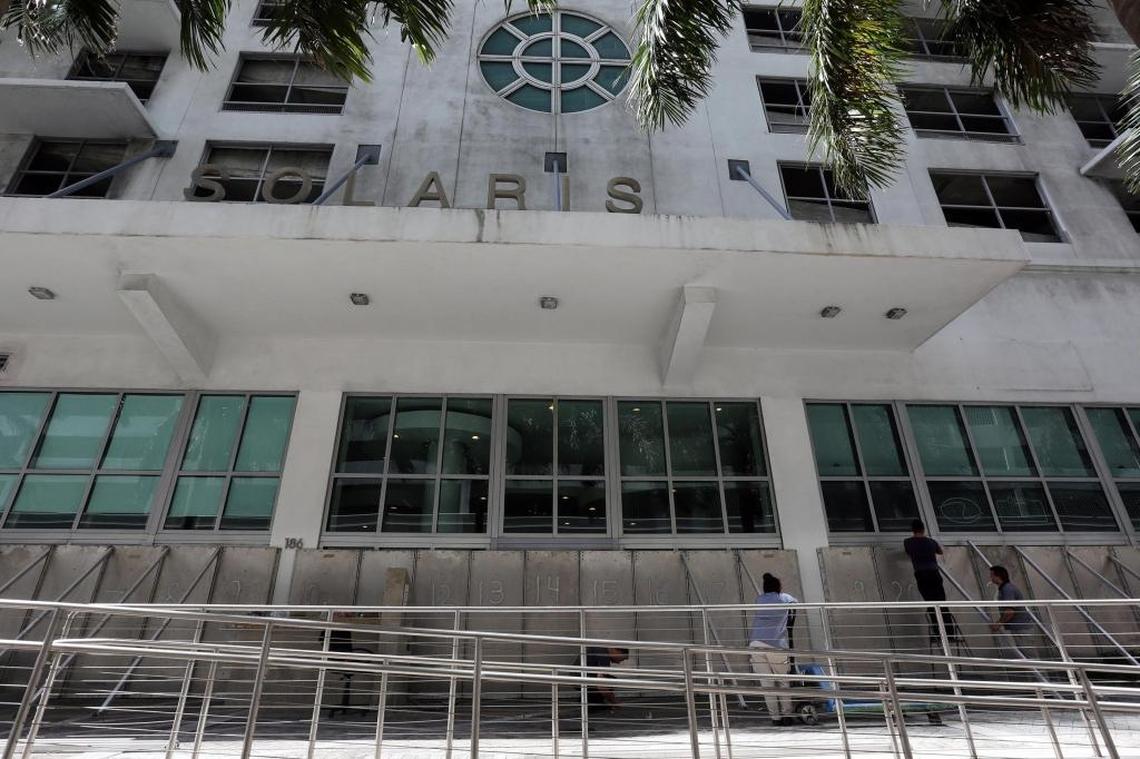 Workers prepare Solaris on Bricelle Avenue on Sept. 8 for Hurricane Irma.