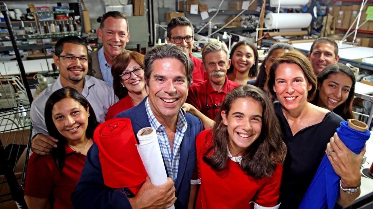 Alexander Arencibia and Menchu Dominicis and their daughter Loriz, with employees at their family business, J.A. Uniforms in West-Miami Dade, June 27, 2017.