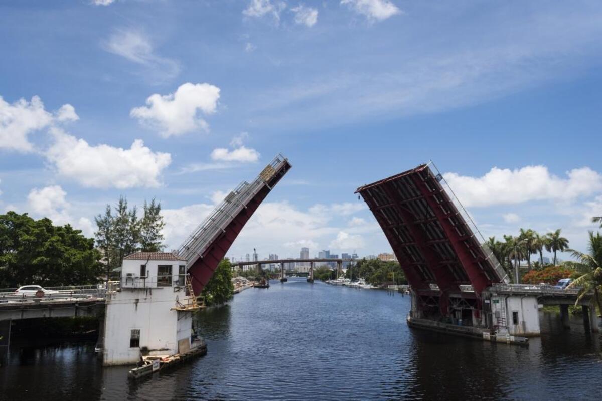 One of the drawbridges the Antillean Marine Shipping Corp. cargo boats pass by opens.