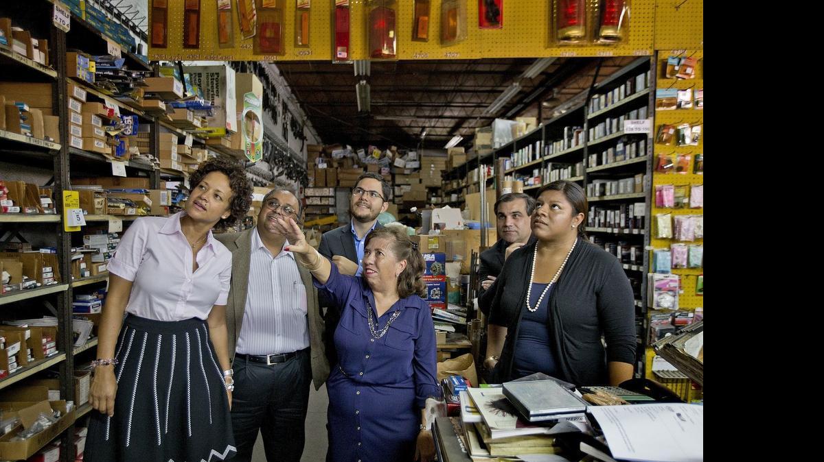 
Margarita Hernandez, center, owner of AAA Million Auto Parts, Inc., and daughter Cristina Hernandez, at right, give a tour to, from left, Althea Harris, SBA representative, and SCORE counselors Raju Mohandes, Julio Canas and Orlando Espinosa on June 22. 
