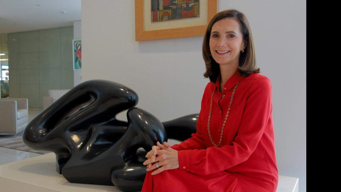 
HOMEGROWN: CEO of Itau Private Bank International, Frances Sevilla-Sacasa, sits next to artwork at her Southeast Financial Center office in Miami.
