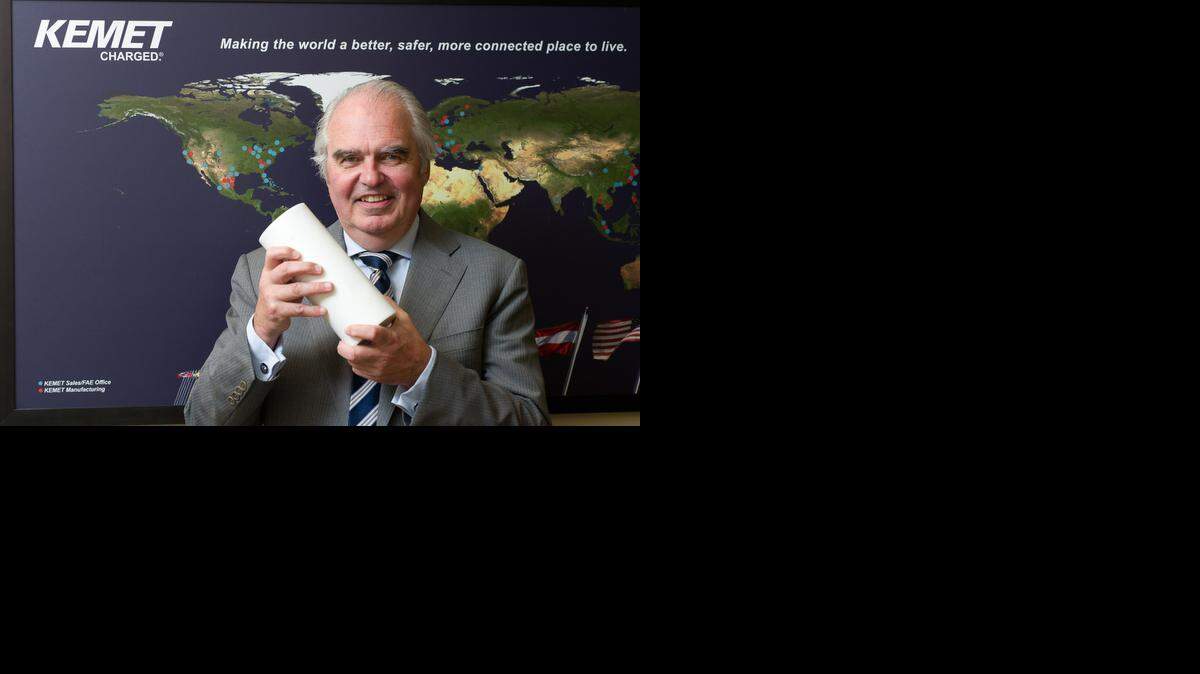 
Per Loof, Chief Executive Officer of KEMET Electronics Corporation, shows off a capacitor, one of the electronic parts his company manufactures, at his office in Fort Lauderdale on March 27, 2015.
